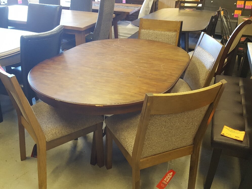 Ashley Oval Walnut Finish Dining Table with Leaf (blemish)